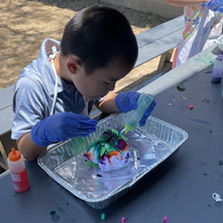 camper making tie dye shirt