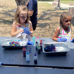 campers making tie dye shirts