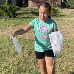 camper catching insects