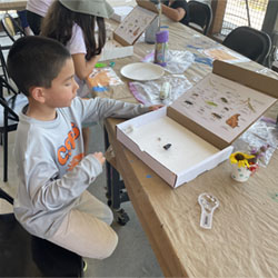 camper making insect box