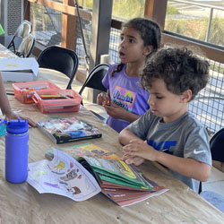 campers reading and coloring