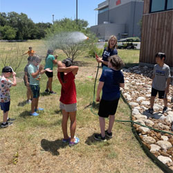 campers playing with water