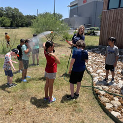 campers playing with water