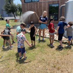 campers playing with water