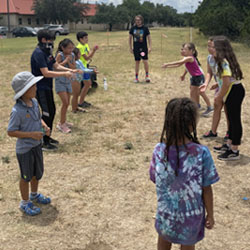 campers playing with water balloons