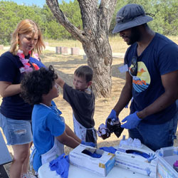 campers making tie dye shirts