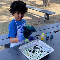 camper making tie dye shirt