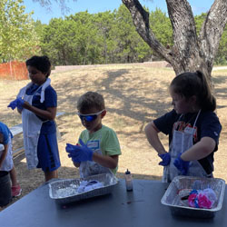 campers making tie dye shirts