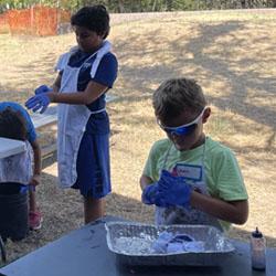 campers making tie dye shirts