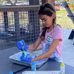 camper making tie dye shirt