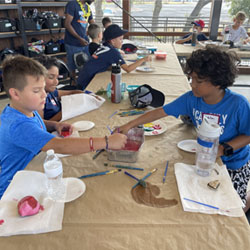 campers painting rocks