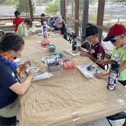 campers painting rocks