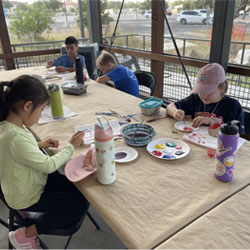 campers painting rocks