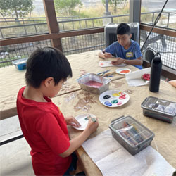 campers painting rocks