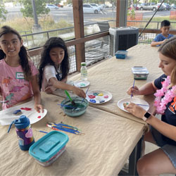 campers painting rocks