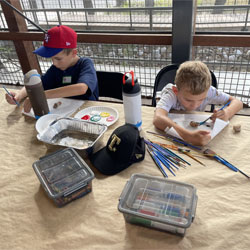 campers painting rocks