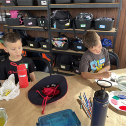 campers painting rocks