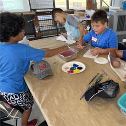 campers painting rocks