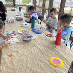 campers painting paper plates