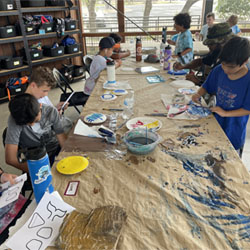 campers painting paper plates