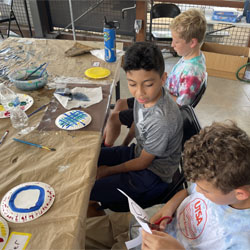 campers painting paper plates