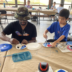 campers painting paper plates