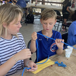 camper making bead fish keychain