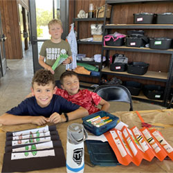 campers making tadpole/frog optical illusions