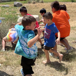 campers playing with water balloons