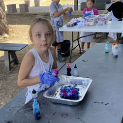 camper making tie dye shirt