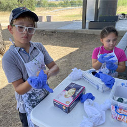 campers making tie dye shirts