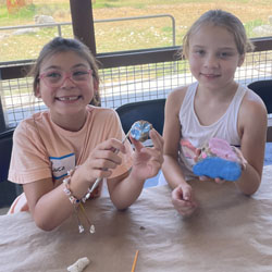 campers painting rocks