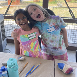 campers painting rocks