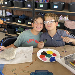 campers painting rocks