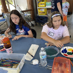 campers painting rocks