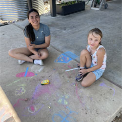 campers making chalk designs