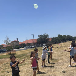 campers playing with water balloons