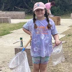 camper holding insect net