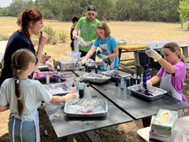 campers making tie-dye shirts