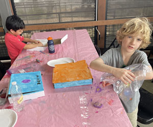 campers making insect boxes