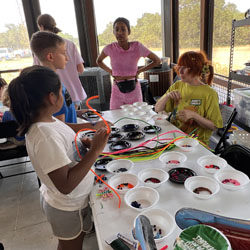 campers making bead key chains