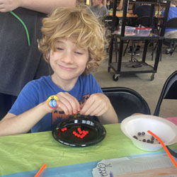 camper making bead key chain