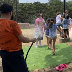 campers being sprayed with water