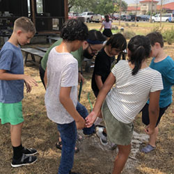 campers rinsing feet with water