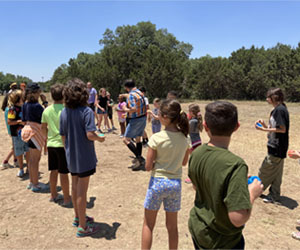 campers playing with water balloons