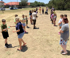 campers playing with water balloons