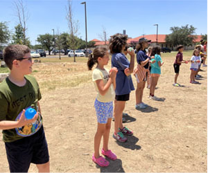 campers playing with water balloons