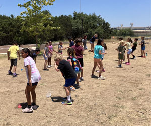 campers playing with water balloons