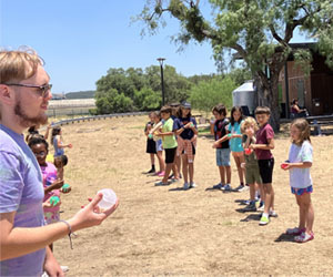 campers playing with water balloons