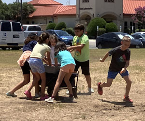 campers playing with water